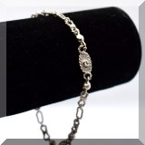 J008. 18K white gold and diamond link bracelet 7” marked 750 - $395 